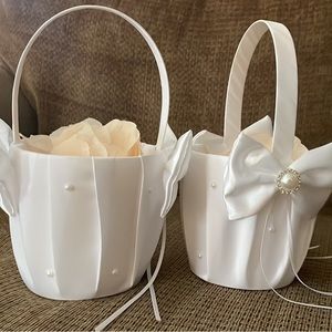 Flower girl baskets. White with peach colored petals.